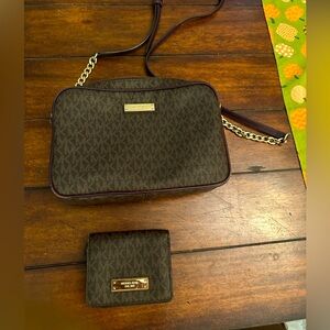 Brown and purple Michael Kors crossbody and small wallet.